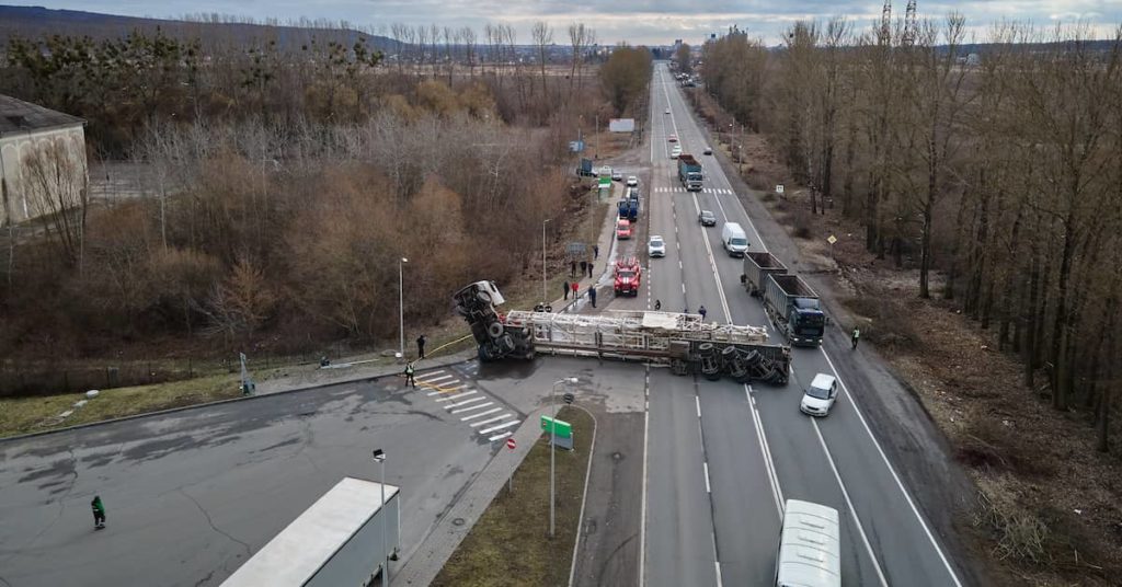 aerial view of a road accident involving an overturned truck