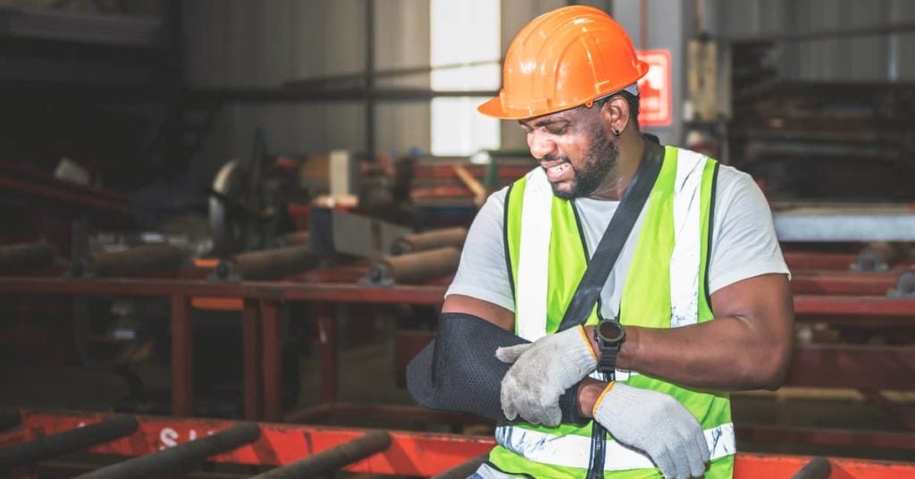 injured worker with his arm in a sling after industrial accident