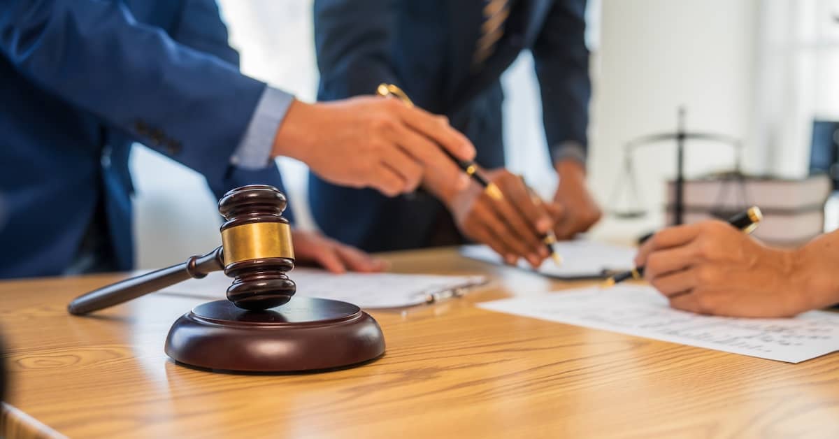 Personal injury lawyers reviewing documents to prove negligence | Colombo Law