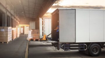 Trucks ready for cargo at the loading dock | Colombo Law