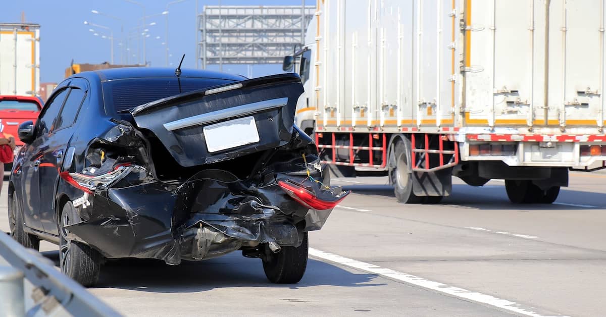 Vehicle with severe damage after being rear-ended by a semi-truck | Colombo Law