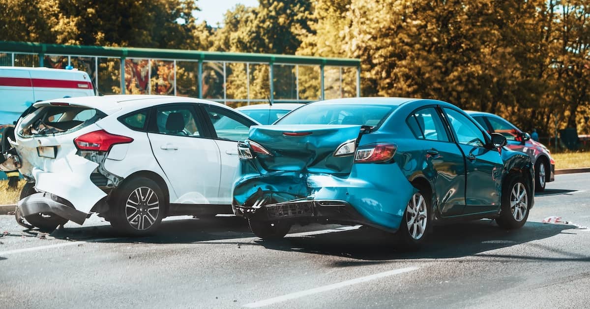Aftermath of a motor vehicle accident in which two cars suffered rear-end damage | Colombo Law